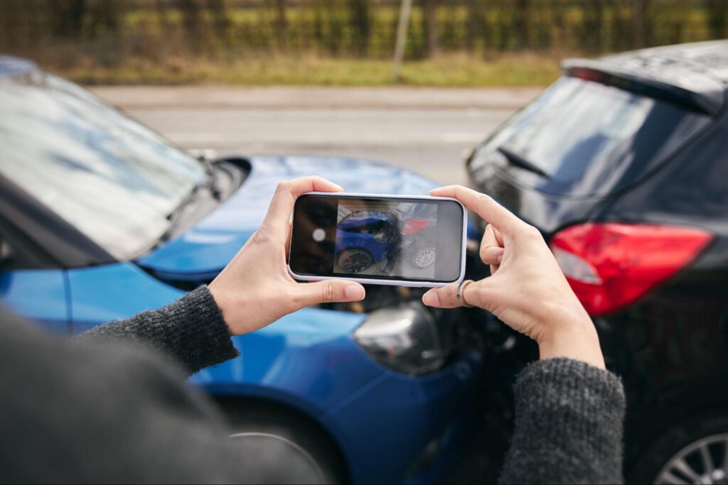 A driver takes photos of a California car accident she has just been in
File name: driver-photos-accident